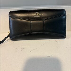 Kate Spade woman’s black clutch wallet